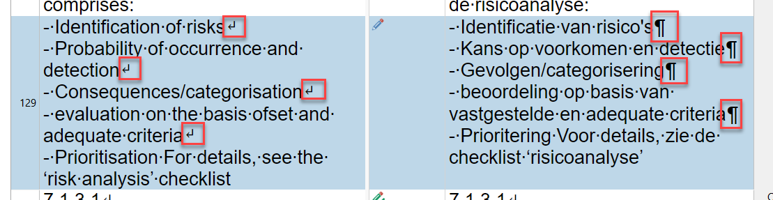 Trados Studio editor showing a translated Excel segment – source has soft return arrows (↵) while target has paragraph marks (¶) for the same line breaks
